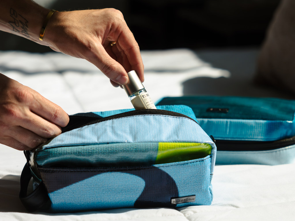 Person packing a wash bag