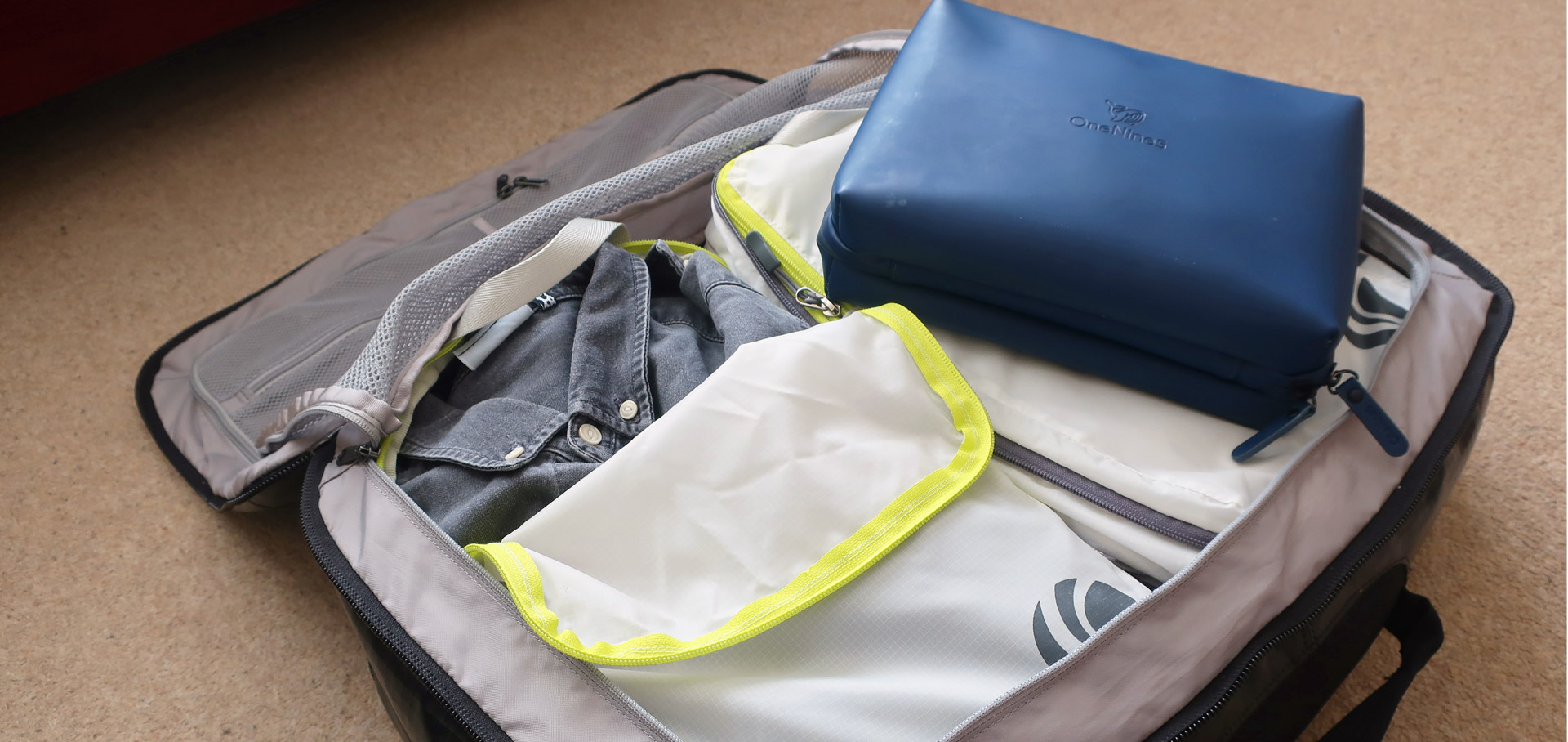 Packed bag with packing cubes and wash bag