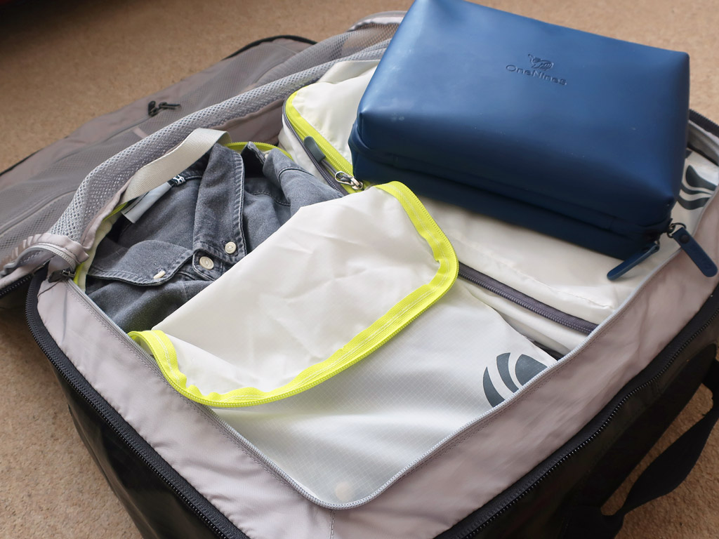 Packed bag with packing cubes and wash bag