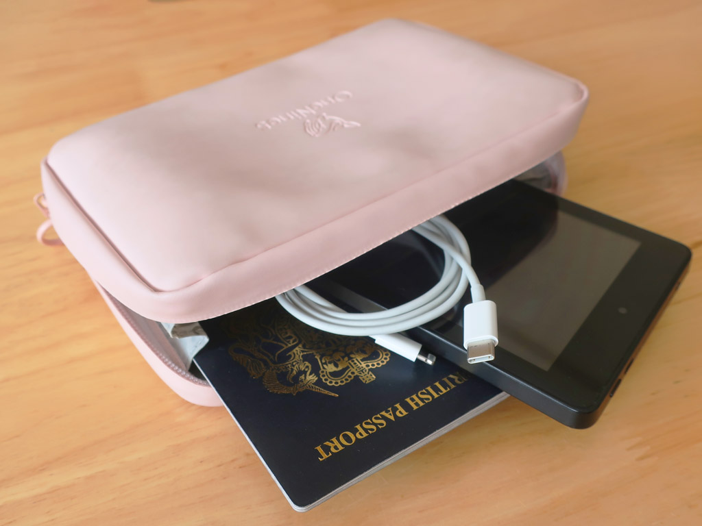 Travel pouch with passport, e-reader and charging cable