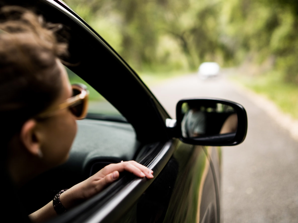 Leaning out of car window