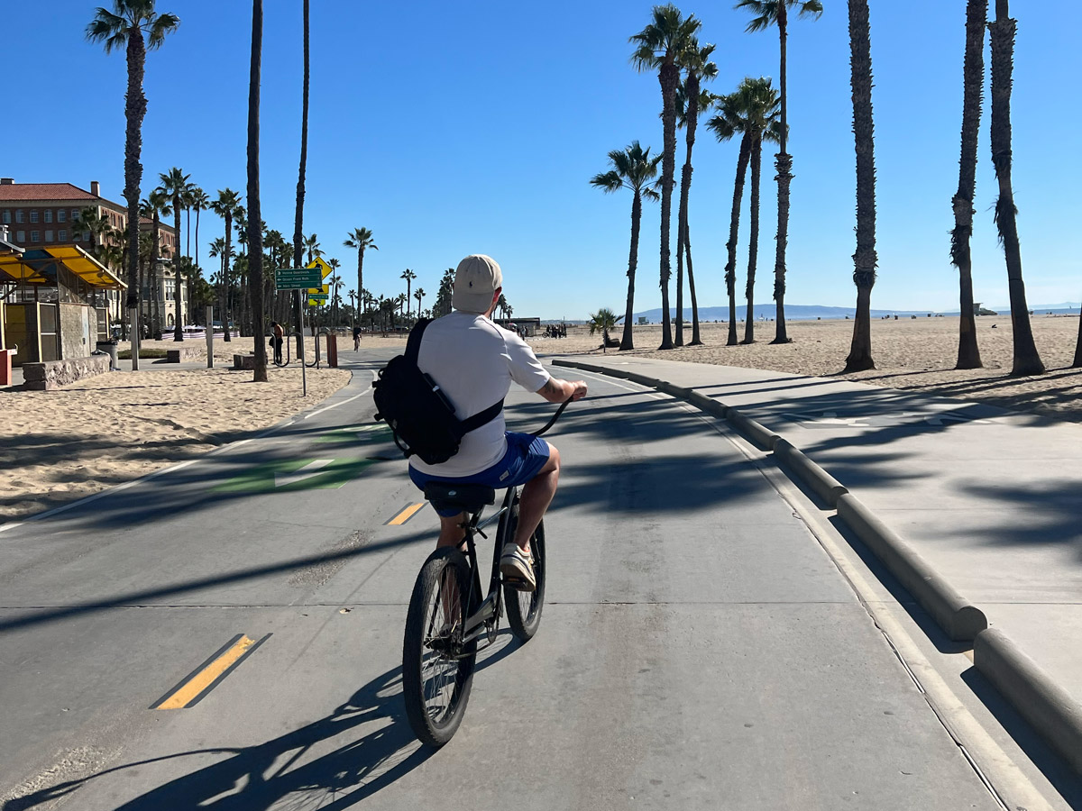Mike riding a bike on Santa Monica beach