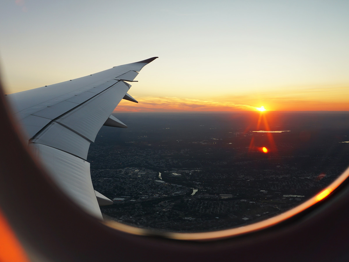 Sunset and wing view from aeroplane window
